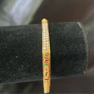 Gold Tone Bangle Bracelet With CZ And Green/Red Accents